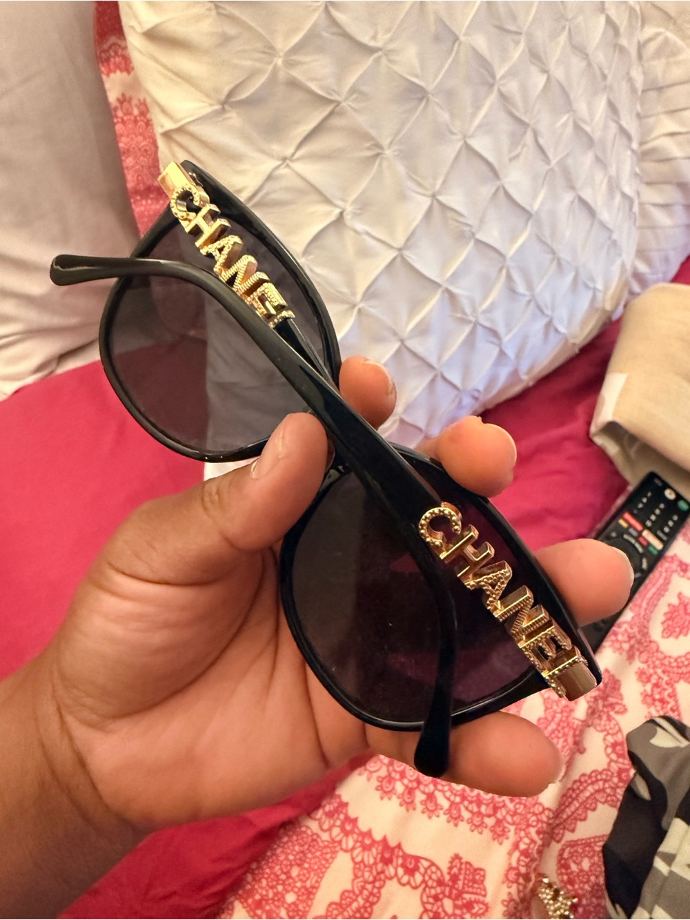 CHANEL Black Sunglasses with Gold Logo Accents